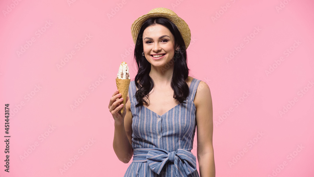 Pretty woman holding ice cream in waffle cone isolated on pink. Pretty woman holding ice cream in waffle cone isolated on pink.