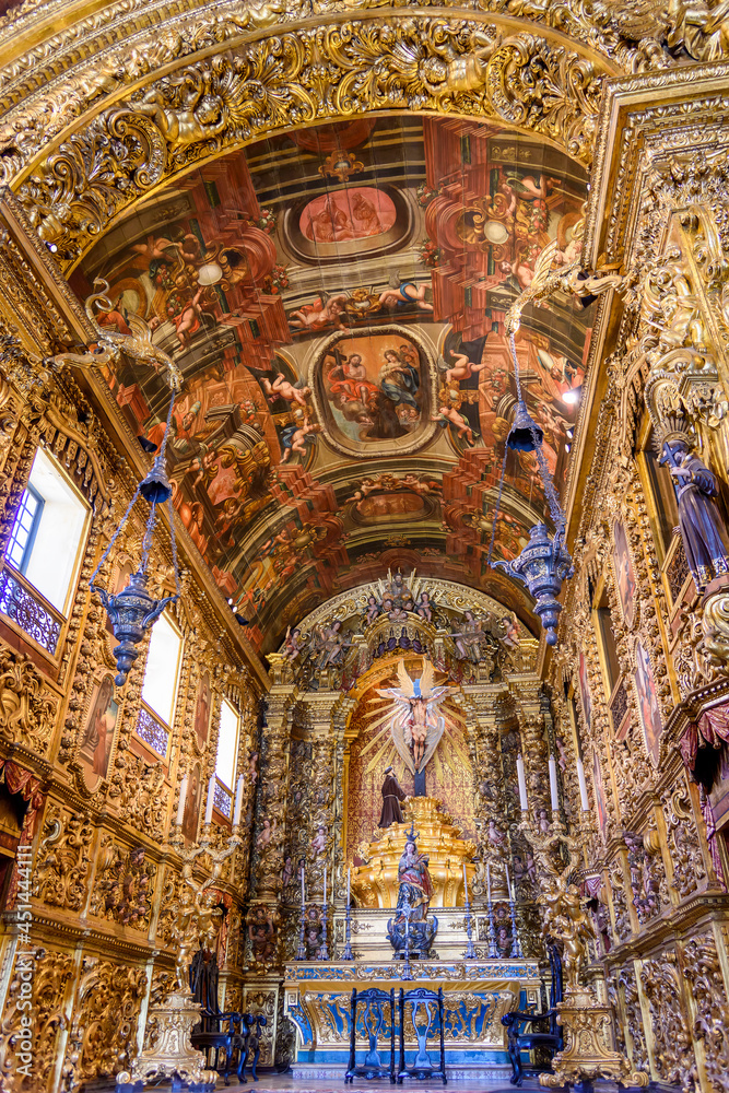 Interior and altar of a brazilian historic ancient church from the 18th century in baroque architecture with details of the walls in gold leaf in the city Rio de Janeiro, Brazil