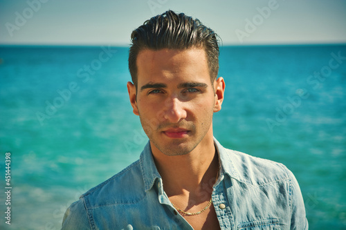 Young Man at Beach in Sunny Summer Day