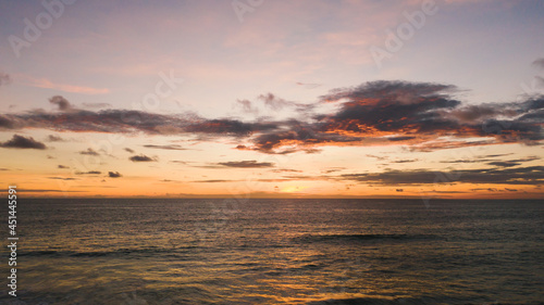 Beautiful sunset over the ocean.The Red sky sun touches horizon. Hawaii   Maldives