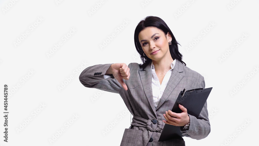 Businesswoman with clipboard showing dislike isolated on white. Businesswoman with clipboard showing dislike isolated on white.