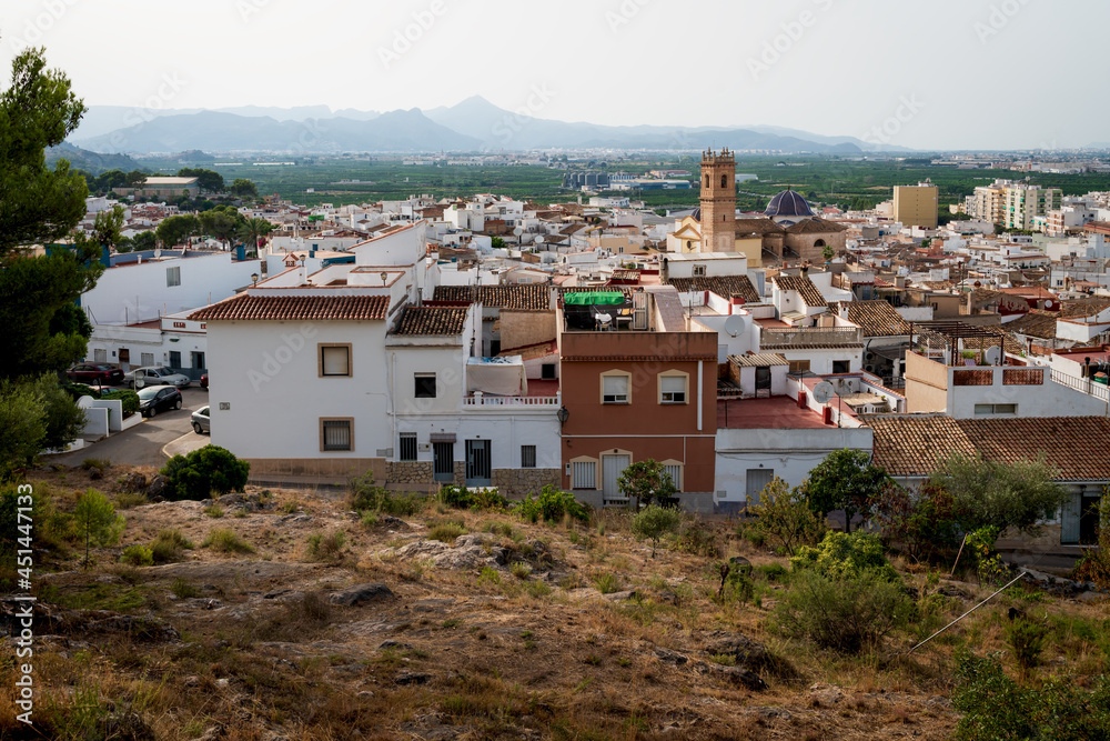 Aerial view on the Spanish old town with the church tower of 'San Roque' in the center, Oliva, Spain