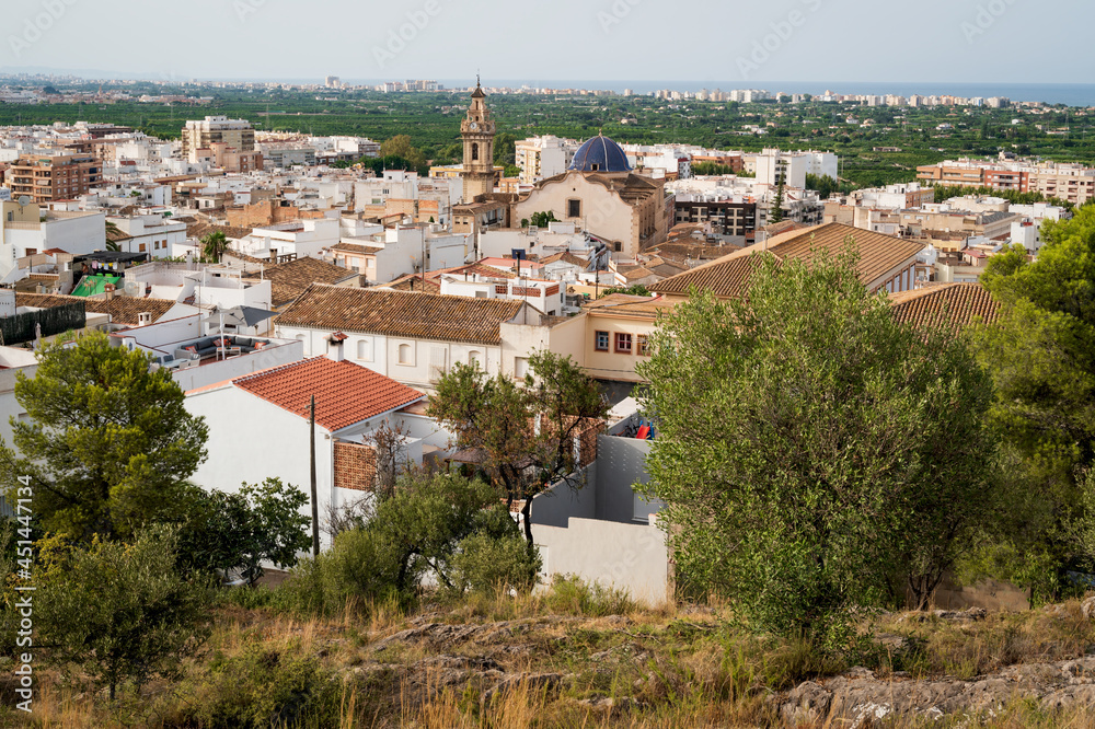 Top view on old city of Oliva with the church tower of 'Santa Maria la Mayor' reaching out, Spain
