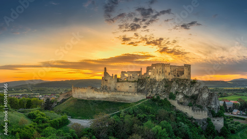 the ruins of Beckov Castle in the light of the setting sun