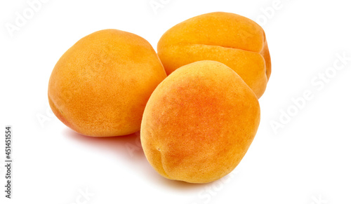 Sweet juicy apricots, ripe nectarines, close-up, isolated on white background.