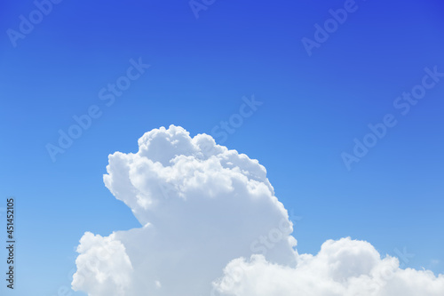 Beautiful view of fluffy white clouds in blue sky © New Africa