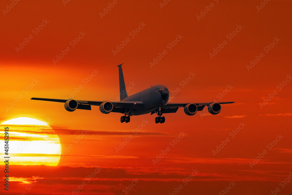 Military planes flying in the air with sunset light background