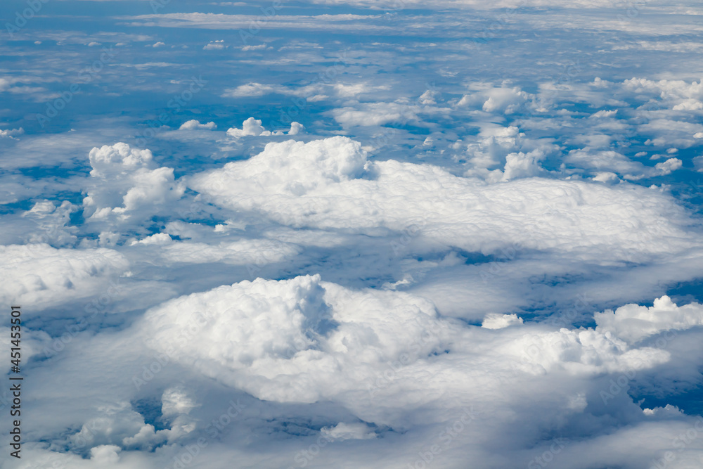 Aerial view to beautiful clouds from plane. Flight from Helsinki to Amsterdam. Aerial view to beautiful clouds from plane. Flight from Helsinki to Amsterdam.