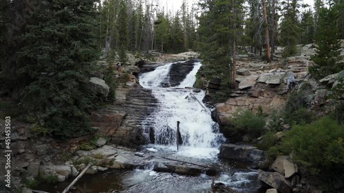 Tilt up wide shot of the beautiful Provo Falls waterfall in the Uinta Wasatch Cache National Forest in Utah on an overcast evening. photo