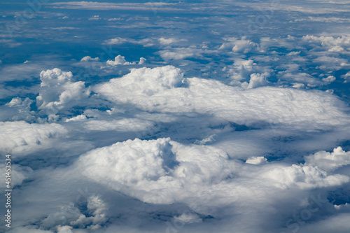 Aerial view to beautiful clouds from plane. Flight from Helsinki to Amsterdam.