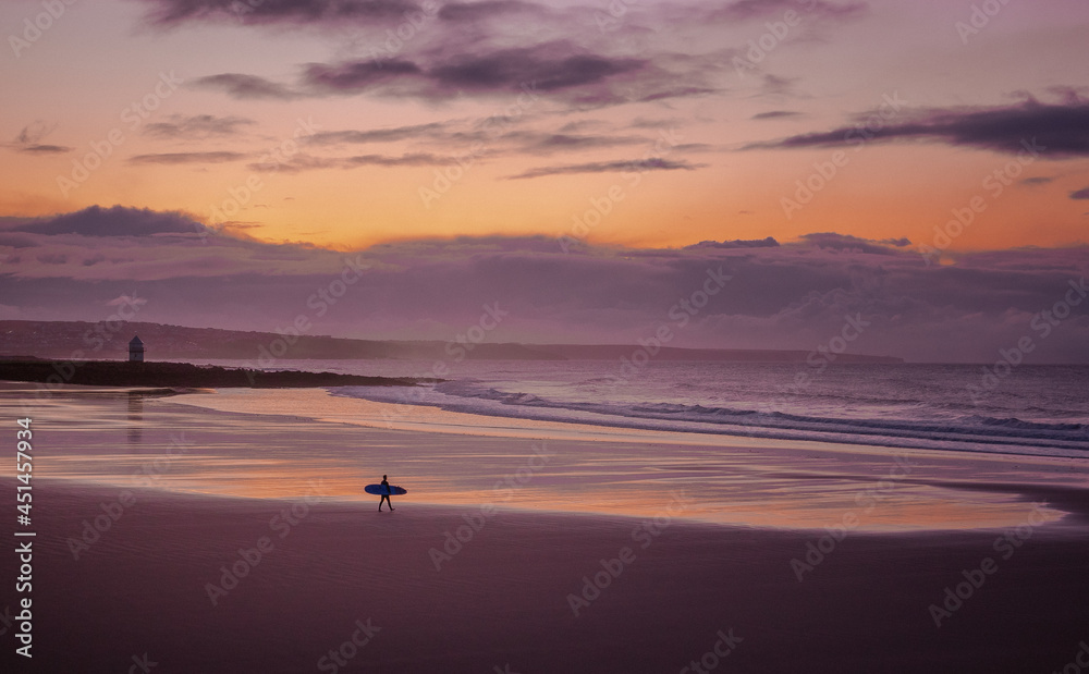 surfing sunset on the beach