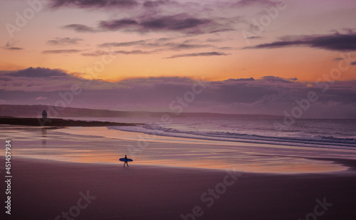 surfing sunset on the beach © Richard
