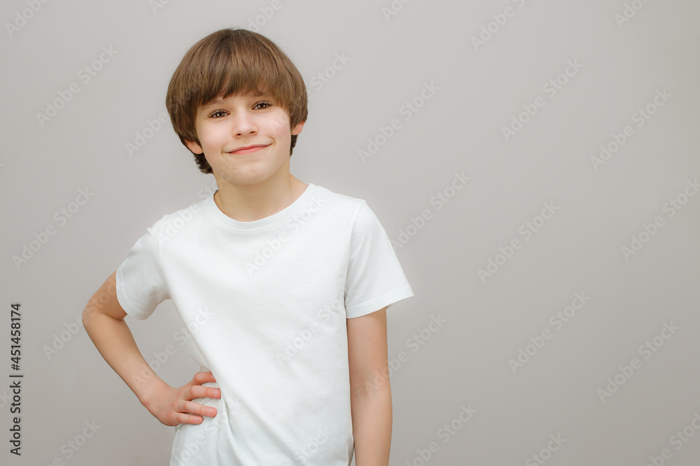 Confident boy in white t-shirt smile at camera. Confident boy in white t-shirt smile at camera.