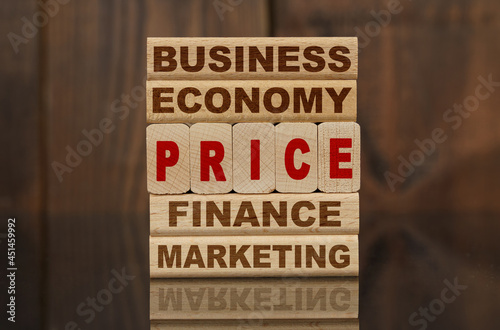 Wallpaper Mural Wooden blocks with the text - Business, Economy, Finance, Marketing and PRICE Torontodigital.ca