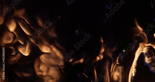 A slow-motion shot of fire flames on a black background.