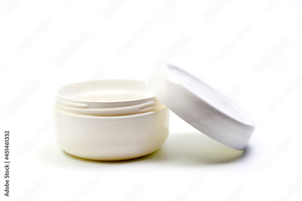 Empty White Plastic opaque cream jar with lid. Isolated on white background. Cosmetic product for skin care Empty White Plastic opaque cream jar with lid. Isolated on white background. Cosmetic product for skin care