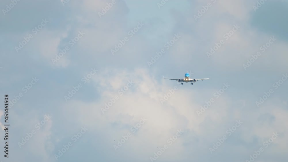 Plane flies front view
