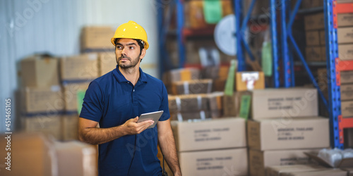 professional warehouse industrial manager using tablet to checking a distribution stock, business man have a inventory work in storage shipping factory, job on storehouse technology