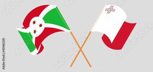 Crossed and waving flags of Burundi and Malta