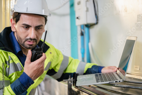 technician engineer working to maintenance a construction equipment industry, production technology in plant factory, man working to safety control system in manufacturing product factory