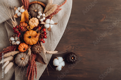 Fototapeta Naklejka Na Ścianę i Meble -  Rustic mockup with autumn table decoration. Floral interior decor for fall holidays
