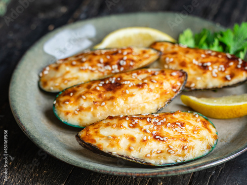 mussels cream sauce baked cheese seafood meal snack on the table copy space food background rustic top view