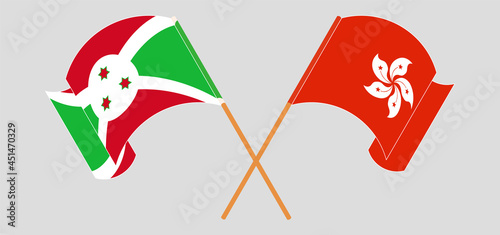 Crossed and waving flags of Burundi and Hong Kong