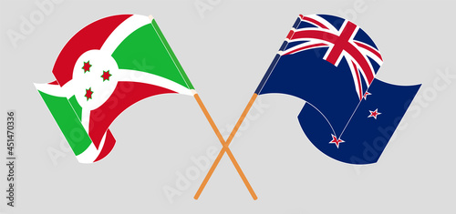 Crossed and waving flags of Burundi and New Zealand