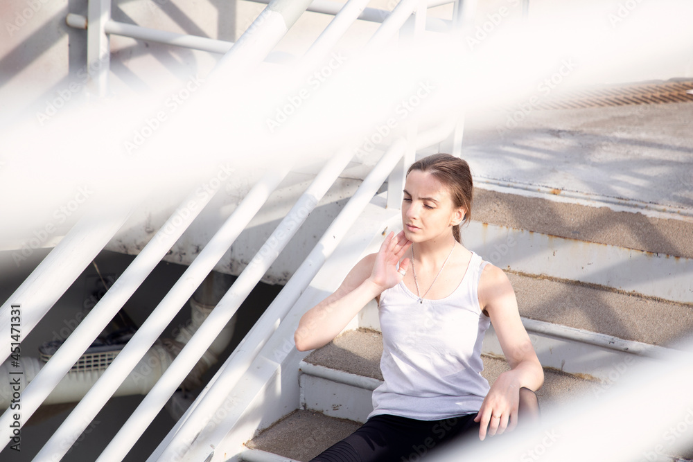 Fototapeta premium Woman resting and posing after jogging