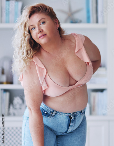 attractive plus size woman wearing jeans and summer top