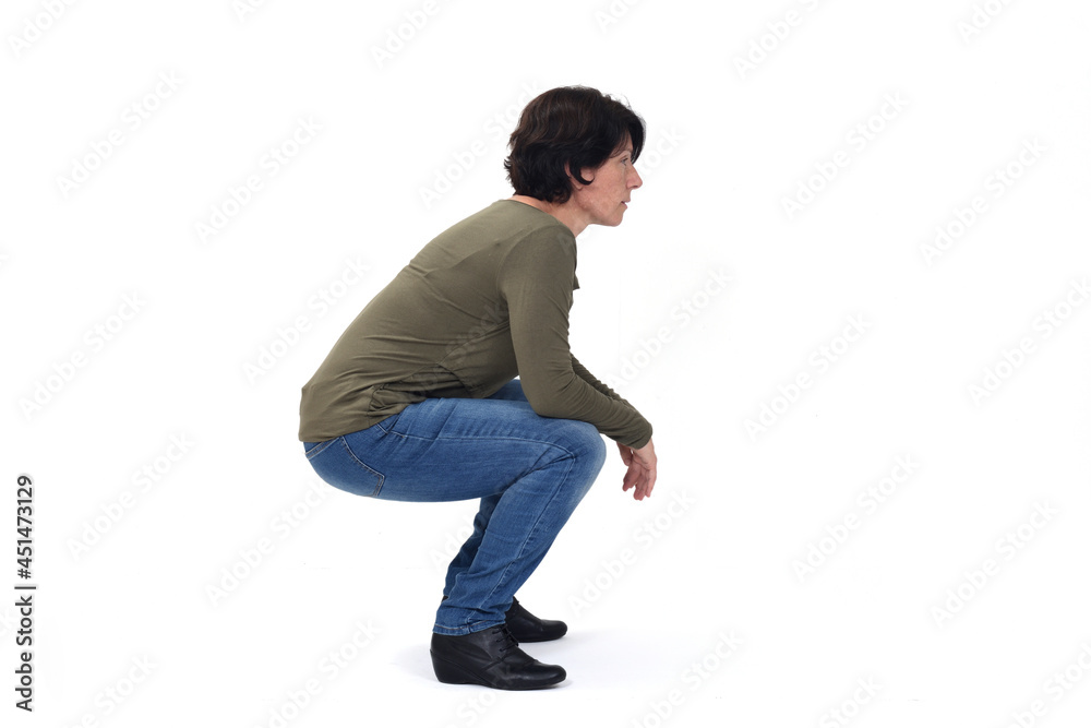 side view of a woman sitting squatting on white background side view of a woman sitting squatting on white background