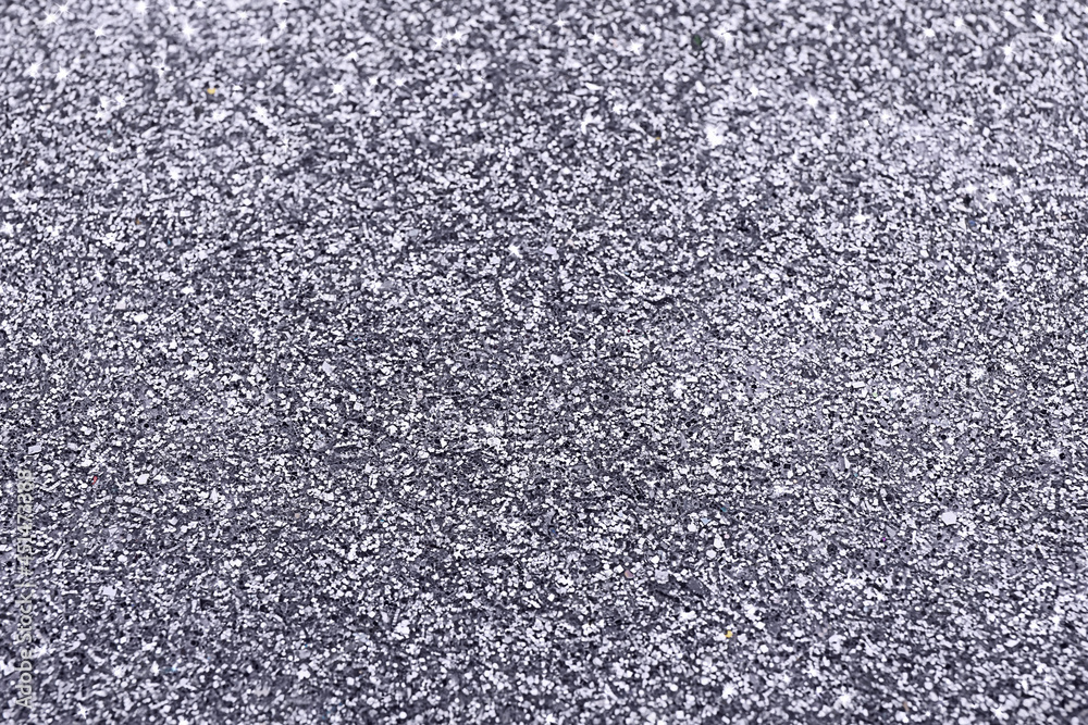 Beautiful shiny grey glitter as background, closeup