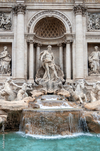 The Trevi Fountain in Rome on a cloudy summer day.