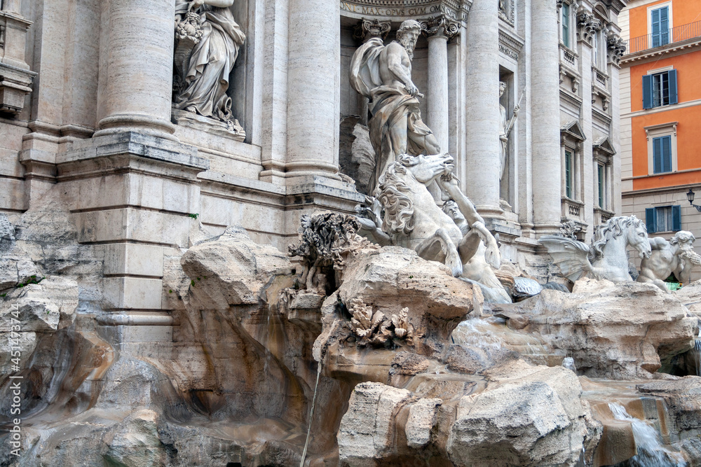 The Trevi Fountain in Rome on a cloudy summer day. The Trevi Fountain in Rome on a cloudy summer day.