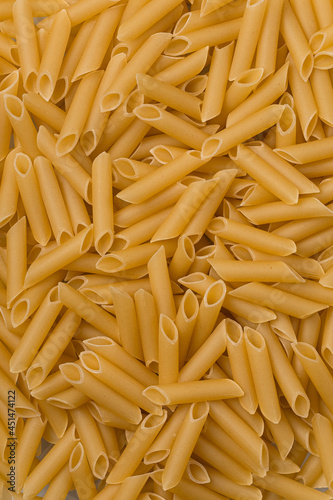 Solid background of raw pasta