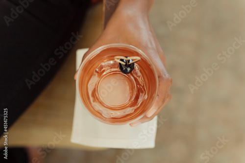 Принти на полотні Close up of a person holding a whisky cocktail