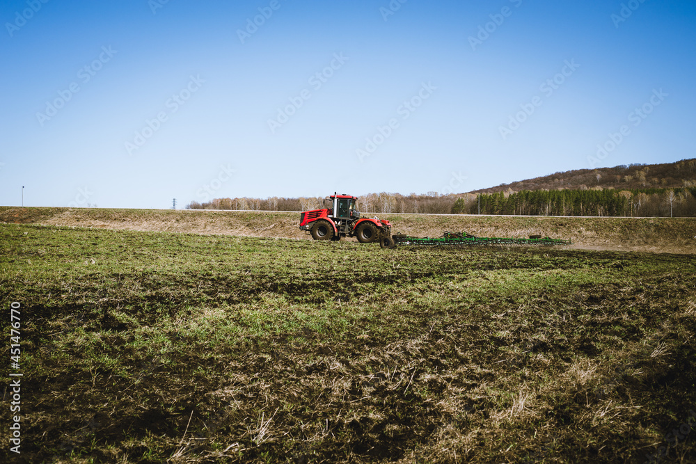 Autumn processing of the field with a tractor. Autumn processing of the field with a tractor.