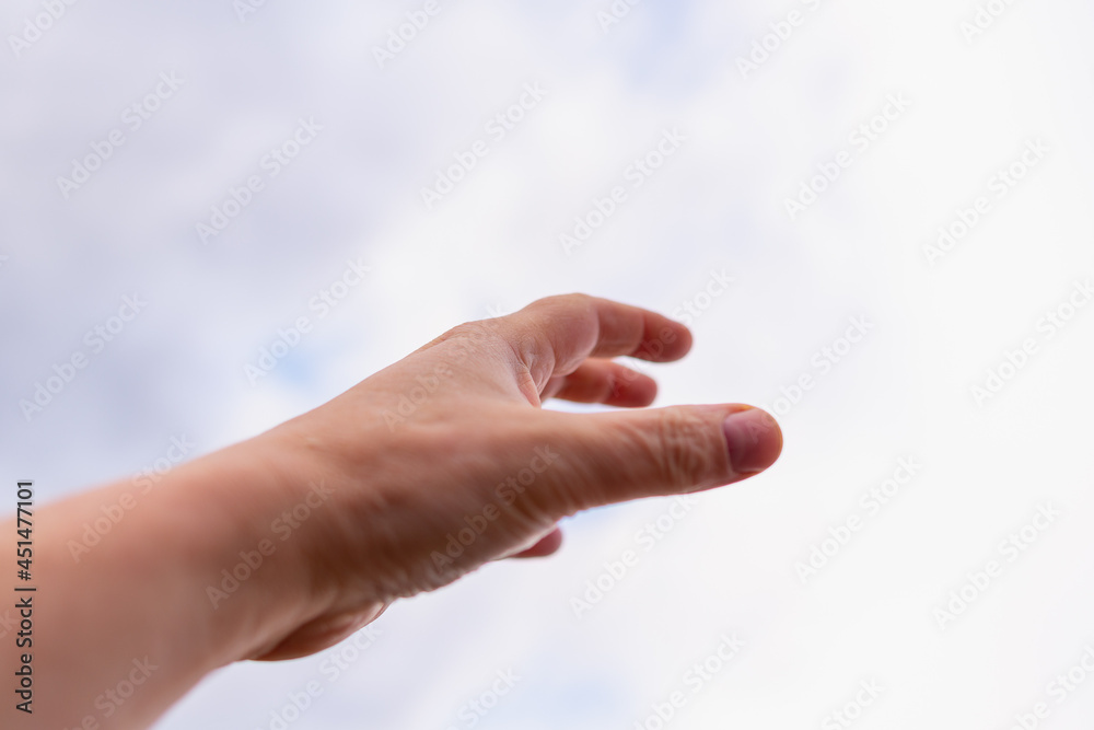 The man stretches his hands to the sky. The man stretches his hands to the sky.