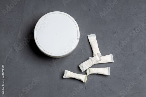 snus nicotine pouch product on concrete background. outer space. chewing nicotine bags. danger unhealthy addiction photo