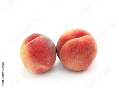 Two ripe peaches.