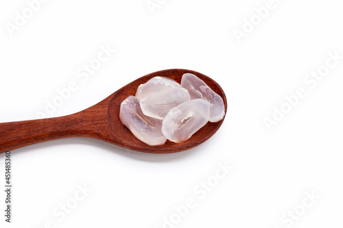 Toddy palm slices in wooden spoon on white background.