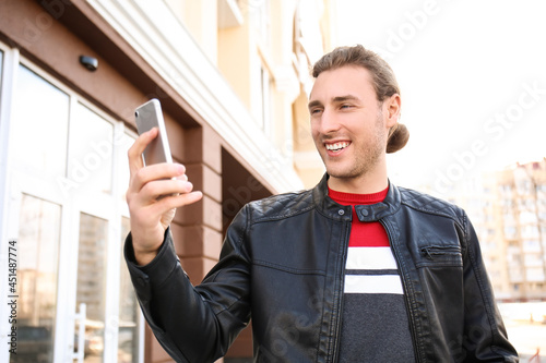 Handsome young man taking s...