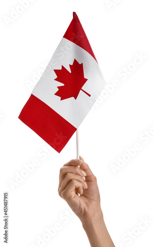 Female hand with the flag of Canada on white background © Pixel-Shot