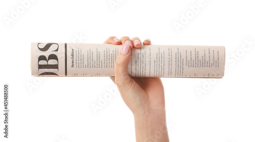 Female hand and newspaper o...