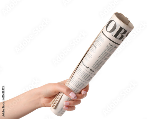 Female hand and newspaper o...