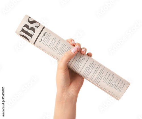 Female hand and newspaper o...