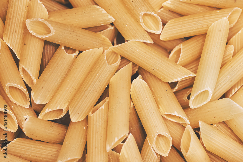 Raw italian penne rigate pasta. Top view. Raw italian penne rigate pasta. Top view.