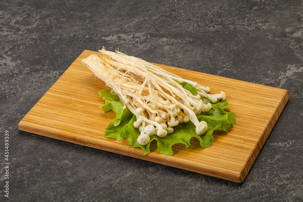 Raw Enoki mushrooms for cooking