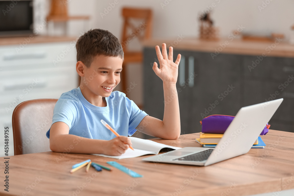 Little boy studying online at home Little boy studying online at home