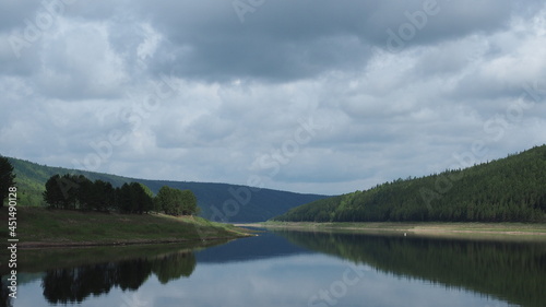Perspective view of large Lena river. Orkutsk oblast, Siberia, Russia. Siberian taiga forest and hills at background.